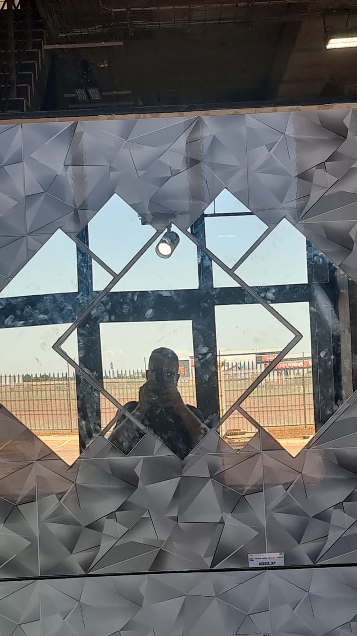 Picture of Mirror stuck with foam tape